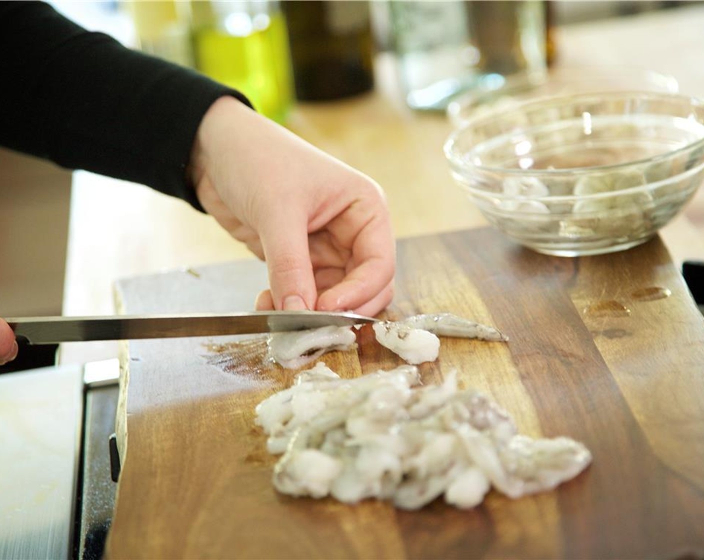 step 7 Pat dry the Shrimp (12) with paper towels. Slice the shrimp in half horizontally through the center and set aside.