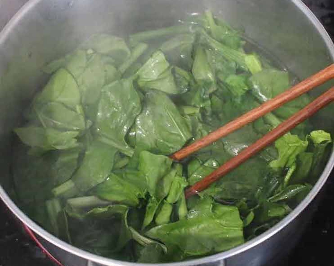step 2 Bring a pot of Water (3 1/3 cups) and half a teaspoon of the Salt (1/2 tsp) to a boil and cook the spinach for 2 minutes.