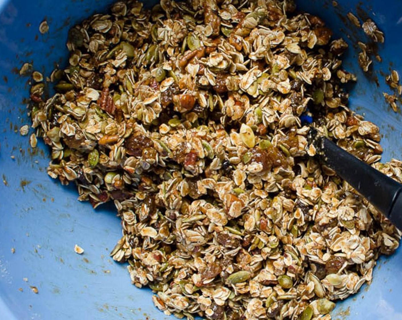 step 6 Transfer the oats and pecans to a large bowl. Add the Wheat Germ (1/2 cup), Pepitas (3/4 cup) and Golden Raisins (1 cup) and toss to combine. Pour the honey mixture over the oat mixture and stir until well coated.