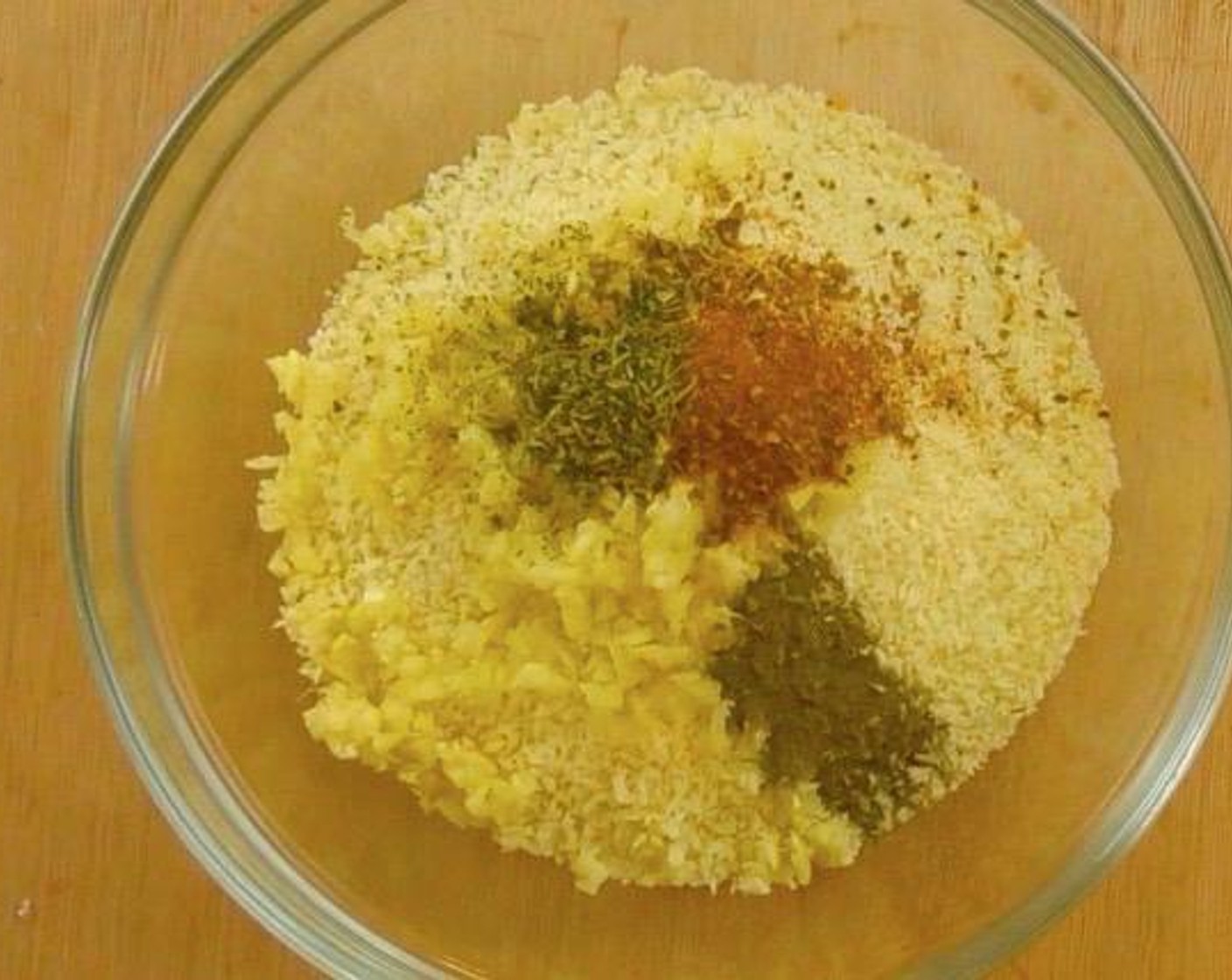 step 1 In a large bowl, add Garlic (5 cloves), Dried Mixed Herbs (1 Tbsp), Cajun Seasoning (1 Tbsp), Ground Black Pepper (1 tsp), Salt (1/4 tsp) into Breadcrumbs (10 cups).