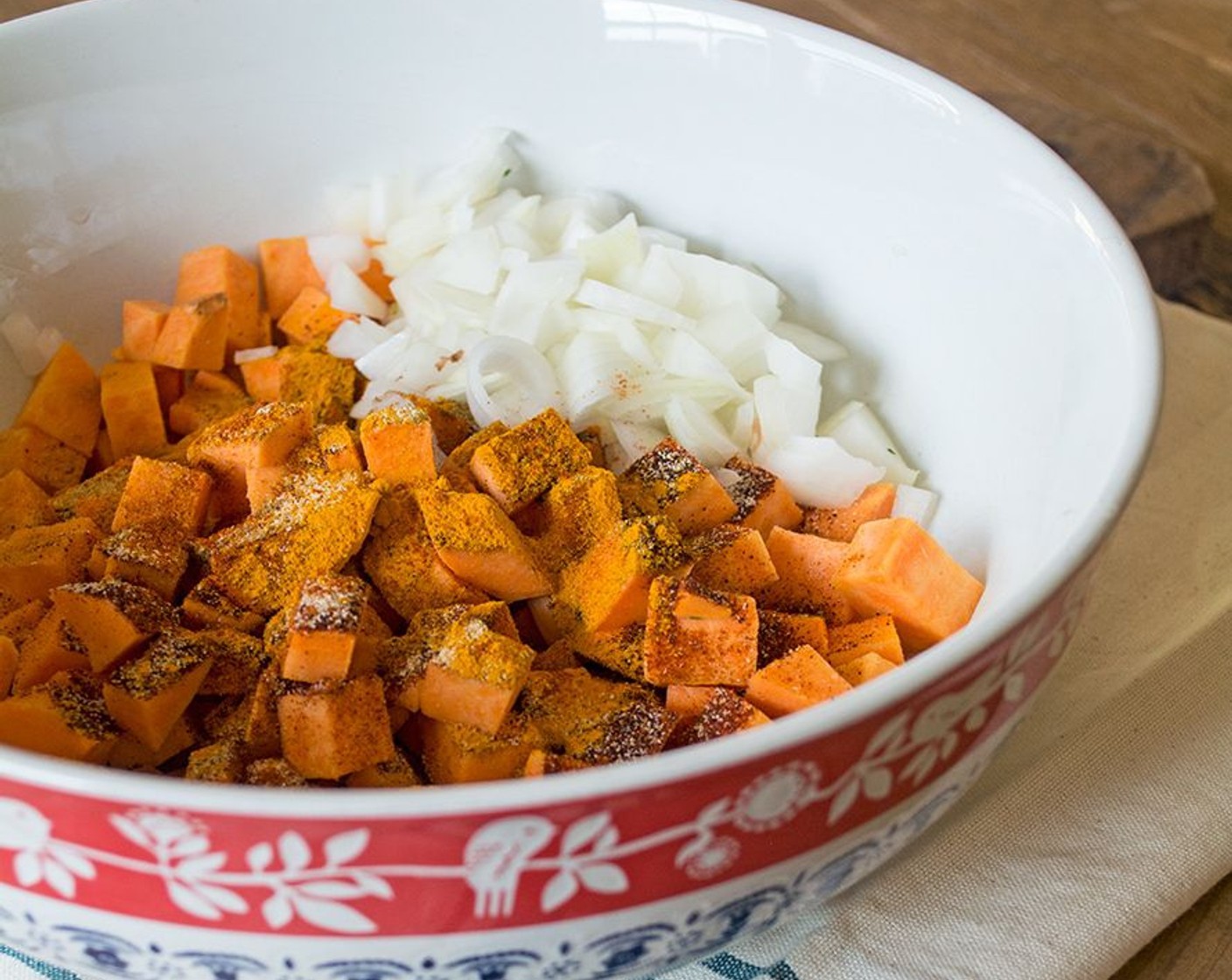 step 8 Drizzle with Coconut Oil (1/2 Tbsp), then sprinkle with Chili Powder (1/2 Tbsp), Ground Cumin (1 tsp), Ground Turmeric (1 tsp), Sea Salt (1/4 tsp), and Ground Black Pepper (1/2 tsp), and toss to coat evenly.