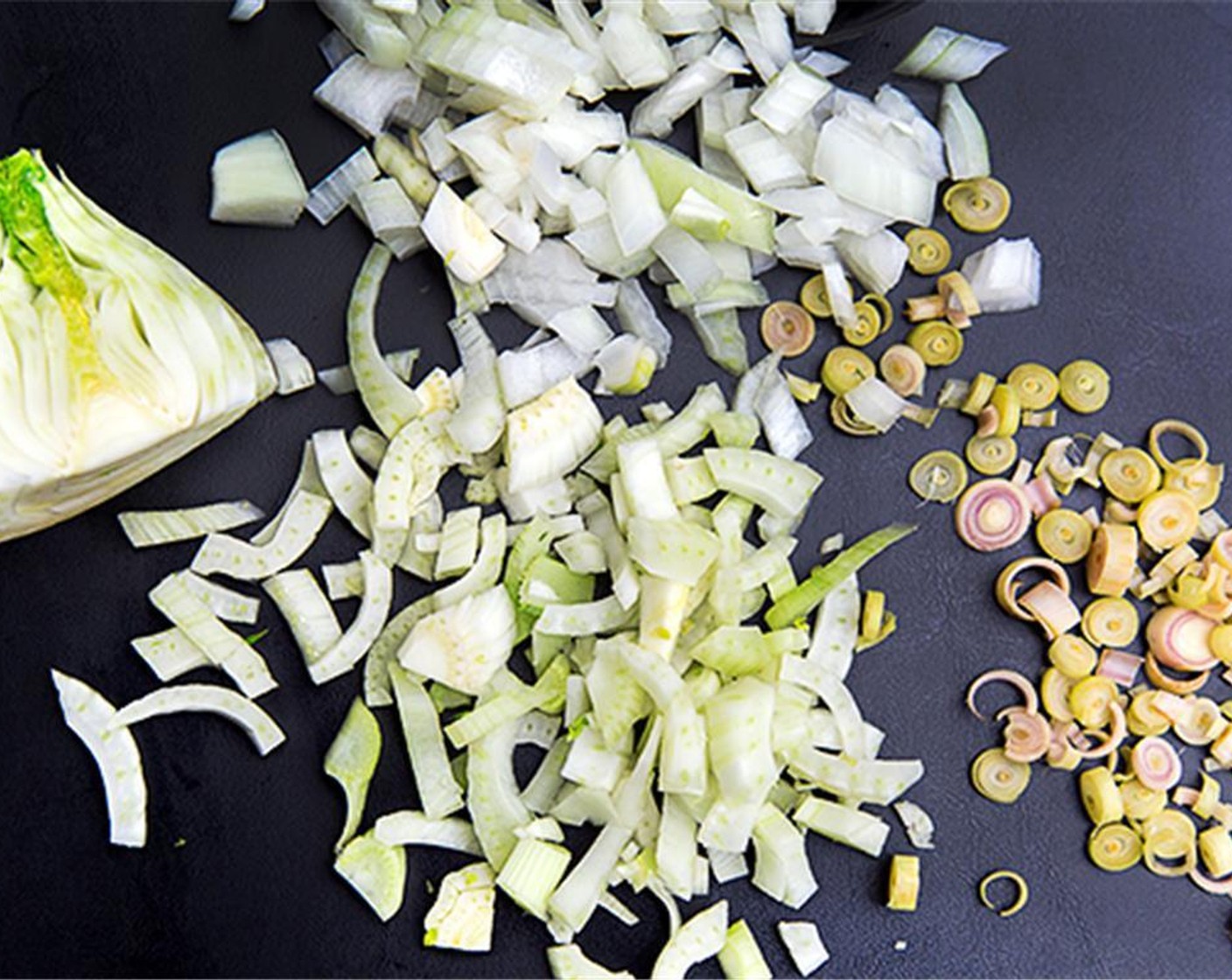 step 1 In a large stock pot, sauté the Onion (1), Lemongrass (1), and Fennel Bulb (1) in Olive Oil (as needed) until translucent.