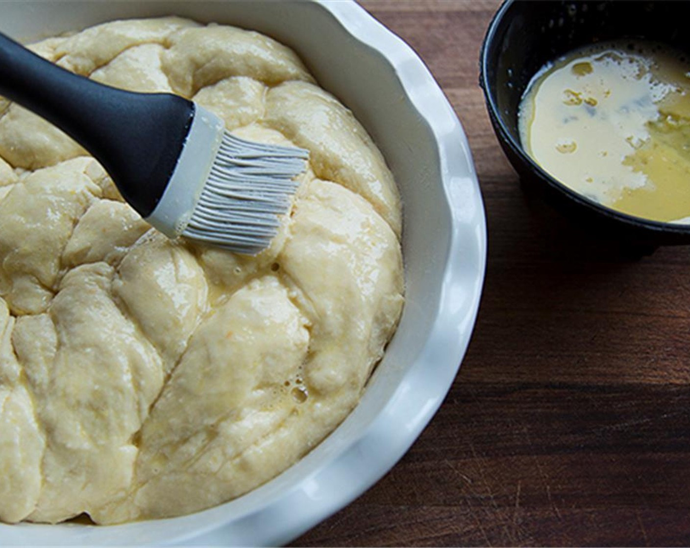 step 10 Beat an Egg (1). Use beaten egg as a glaze. Brush the dough with glaze.