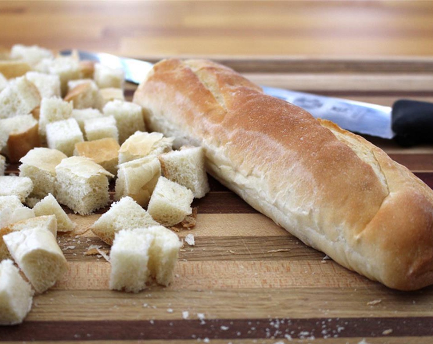 step 2 Cut Bread (3 cups) into cubes. Toss bread with Olive Oil (1 tsp), Salt (to taste), and Ground Black Pepper (to taste). Place on a baking sheet, bake for 10 minutes, flip, and bake for about 5 minutes more.