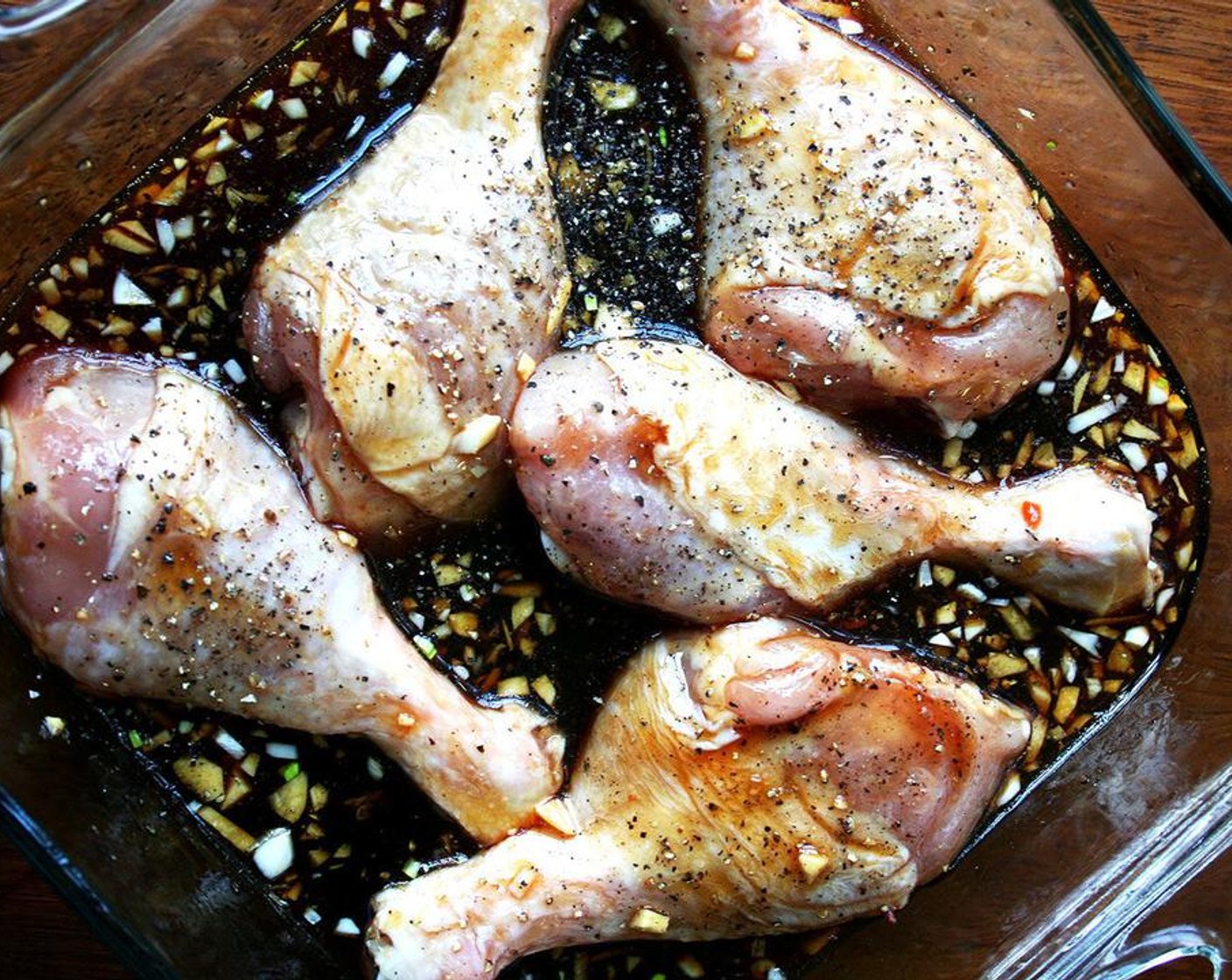 step 4 Pour over chicken. Toss chicken and then arrange skin-side down in the baking pan. Place in the oven for 30 minutes.