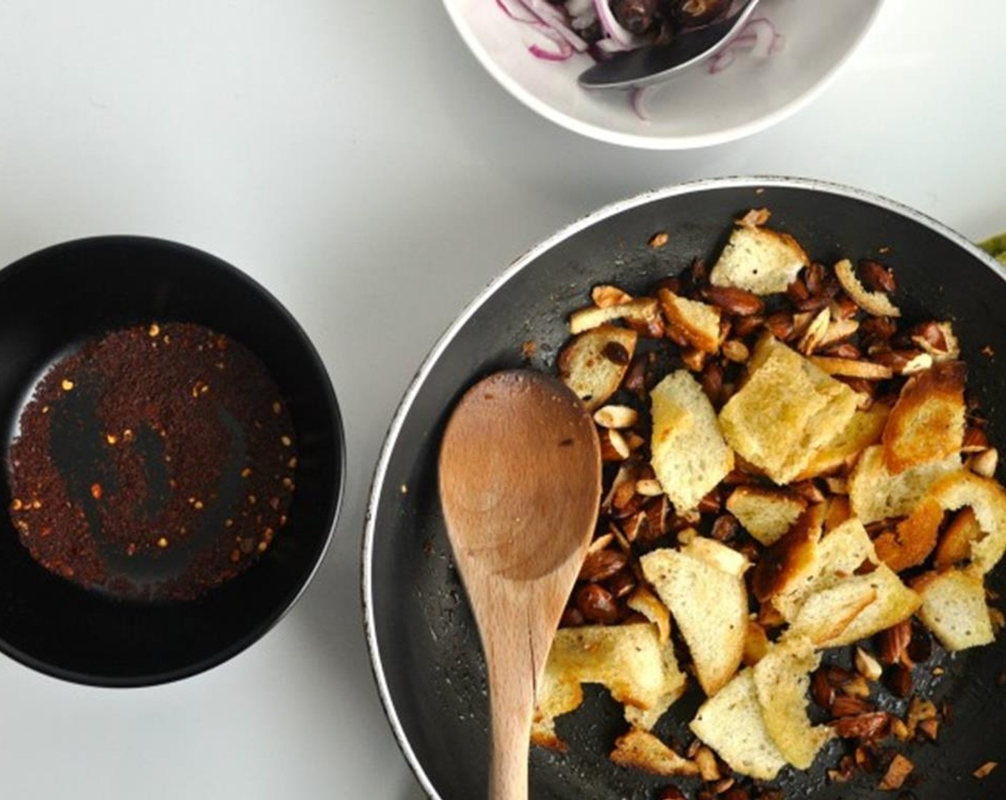 step 3 Fry chopped almonds and sliced bread in butter/olive oil mixture until golden brown.