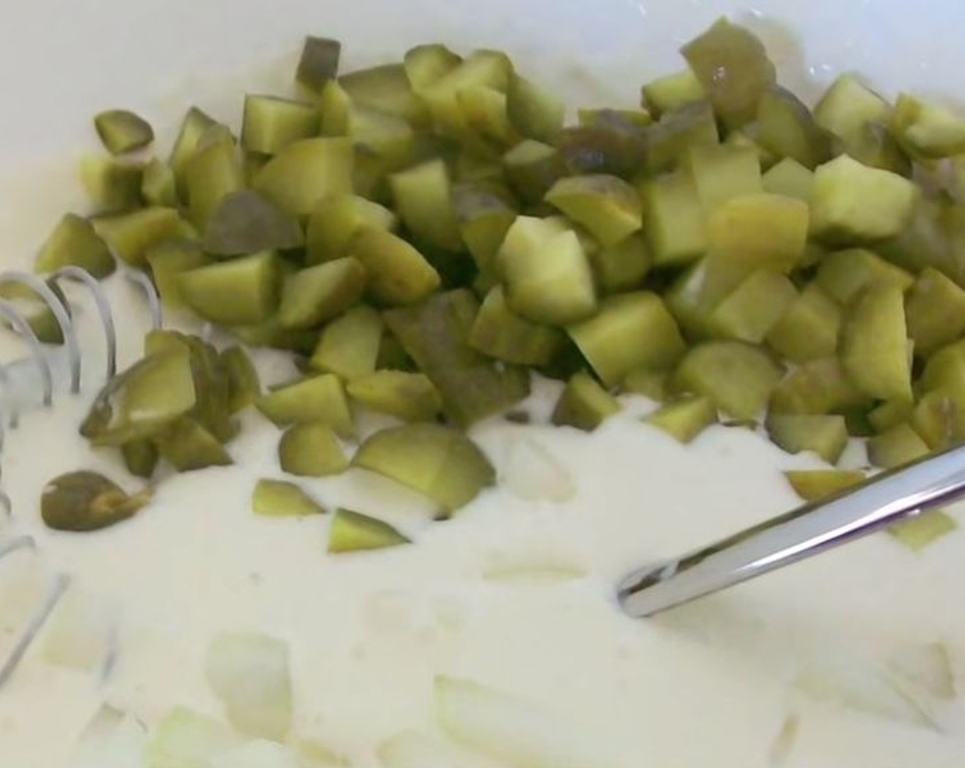 step 2 Into a serving bowl, add Mayonnaise (1 cup) and Pickle Juice (1/2 cup). Whisk until smooth. Add Onion (1) and Dill Pickles (3), then stir to incorporate.