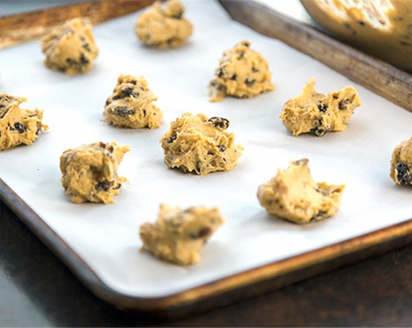 step 7 Drop by spoonfuls on cookie sheets lined with parchment paper. Bake about 12 to 15 minutes.