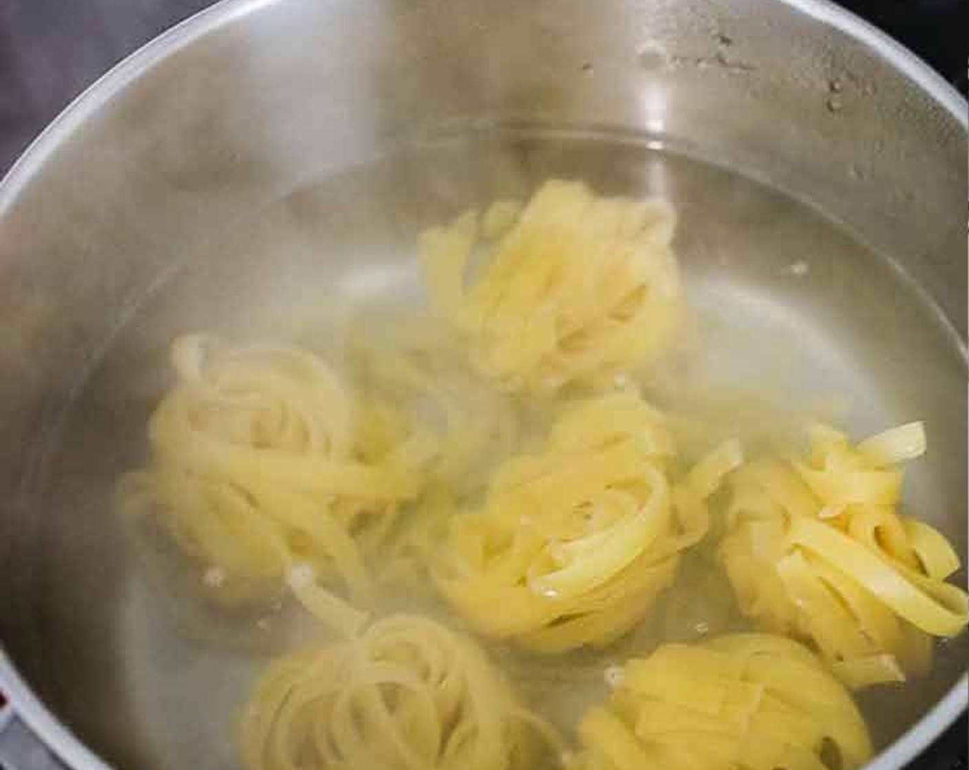 step 1 Bring Water (3 1/3 cups) with Salt (1 tsp) to a boil. Once boiling, cook the Tagliatelle (6.5 oz) according to package instructions.
