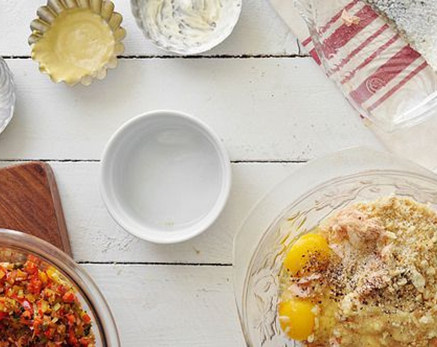 step 8 Separate the salmon from it’s skin and flake it into a large mixing bowl. Add the Mayonnaise (1/2 cup), Dijon Mustard (1 Tbsp), bread crumbs, cooked veggies, Farmhouse Eggs® Large Brown Eggs (2), and a bit more salt and pepper.