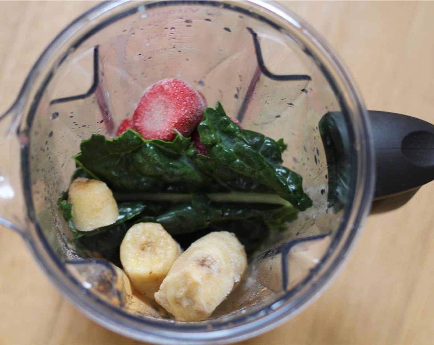 step 1 In a blender, add the Almond Milk (1 cup), Cacao Nibs (2 Tbsp), Kale (2 cups), Banana (1), Frozen Strawberries (1/4 cup), Vanilla Whey Protein Powder (1/4 cup), and Ground Cinnamon (1/8 tsp).