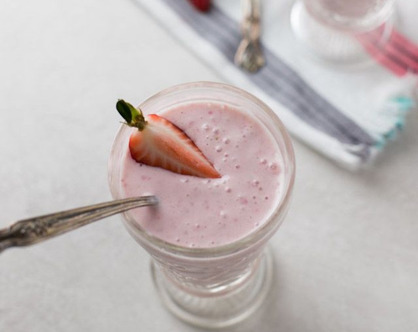 step 1 Blend Frozen Strawberries (1/2 cup), Banana (1/2), Plain Greek Yogurt (1/2 cup), Reduced-Fat Cream Cheese (3 Tbsp), 2% Reduced Fat Milk (1 cup), Honey (1 Tbsp) and Vanilla Extract (1/2 tsp) together. Refrigerate until ready to serve.