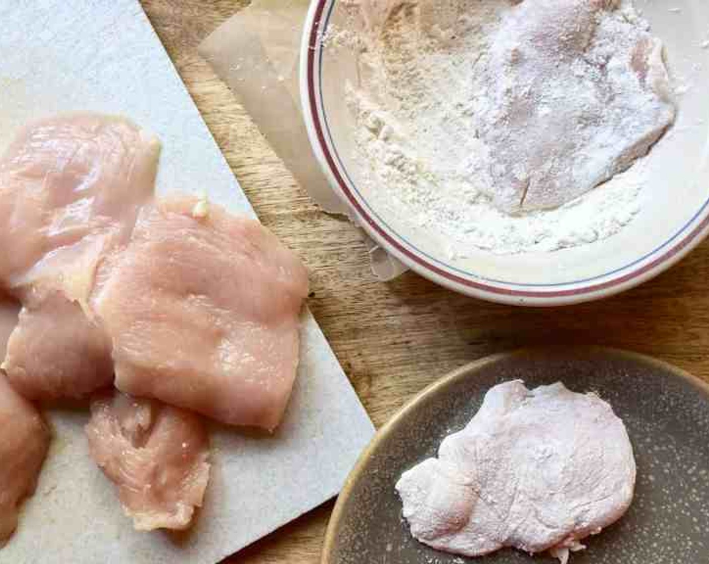 step 6 Dredge each piece of Boneless, Skinless Chicken Breast (1 lb) through the flour turning to coat evenly. Shake any excess flour back into the bowl. Lay the chicken on a plate and repeat.