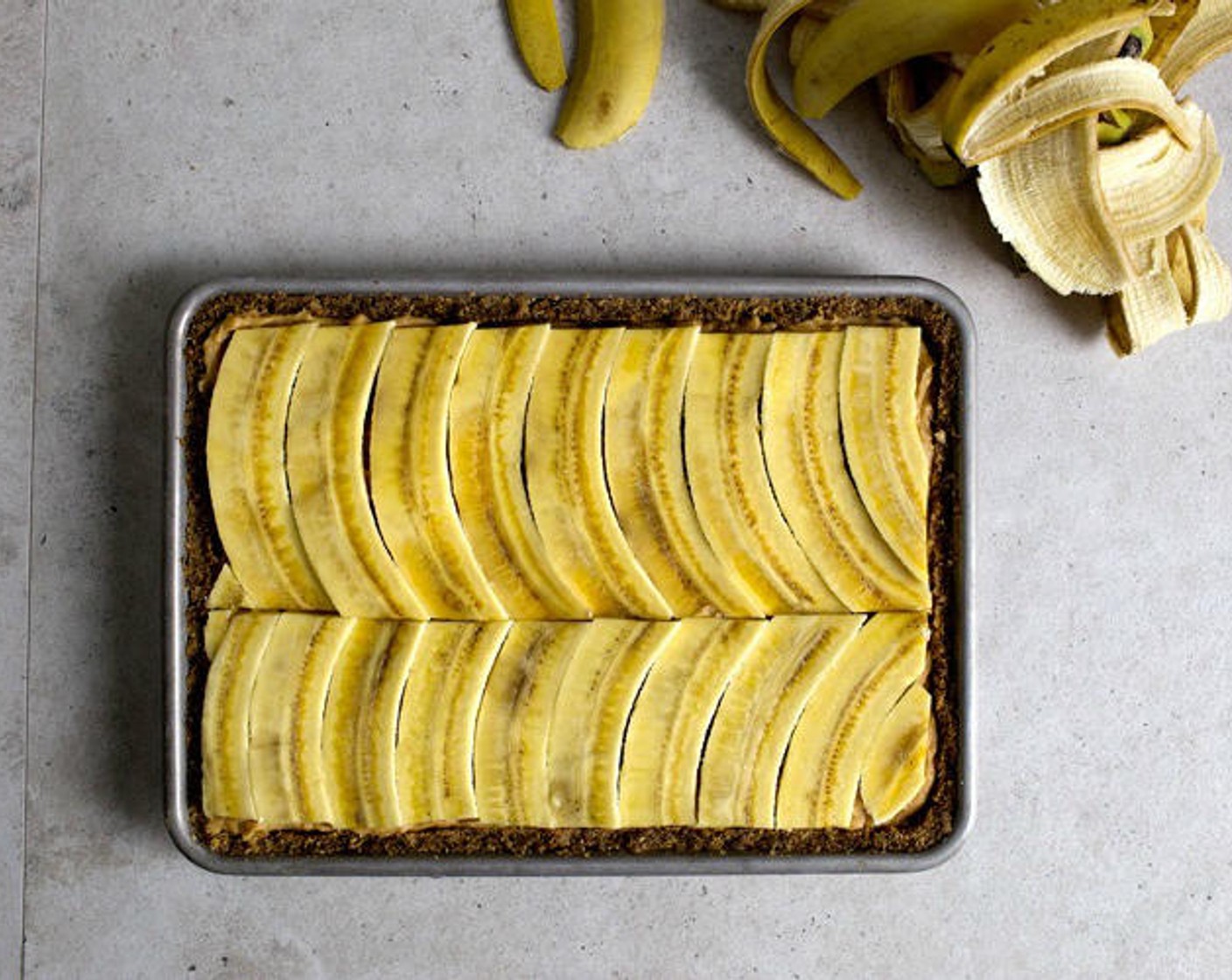 step 12 Transfer into the pie. It should line one side of the pie. Now repeat the same thing with the other side to fill the entire area. Eat the scrap-bananas.