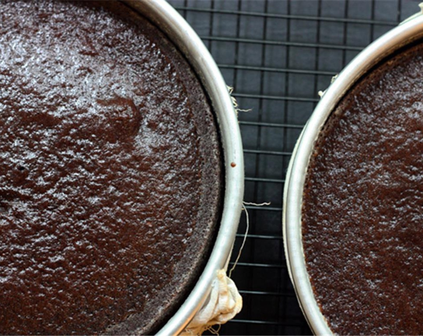 step 6 Remove pans to a cooling rack and let cool for 10 minutes or until sides of cakes have pulled away from the pans.