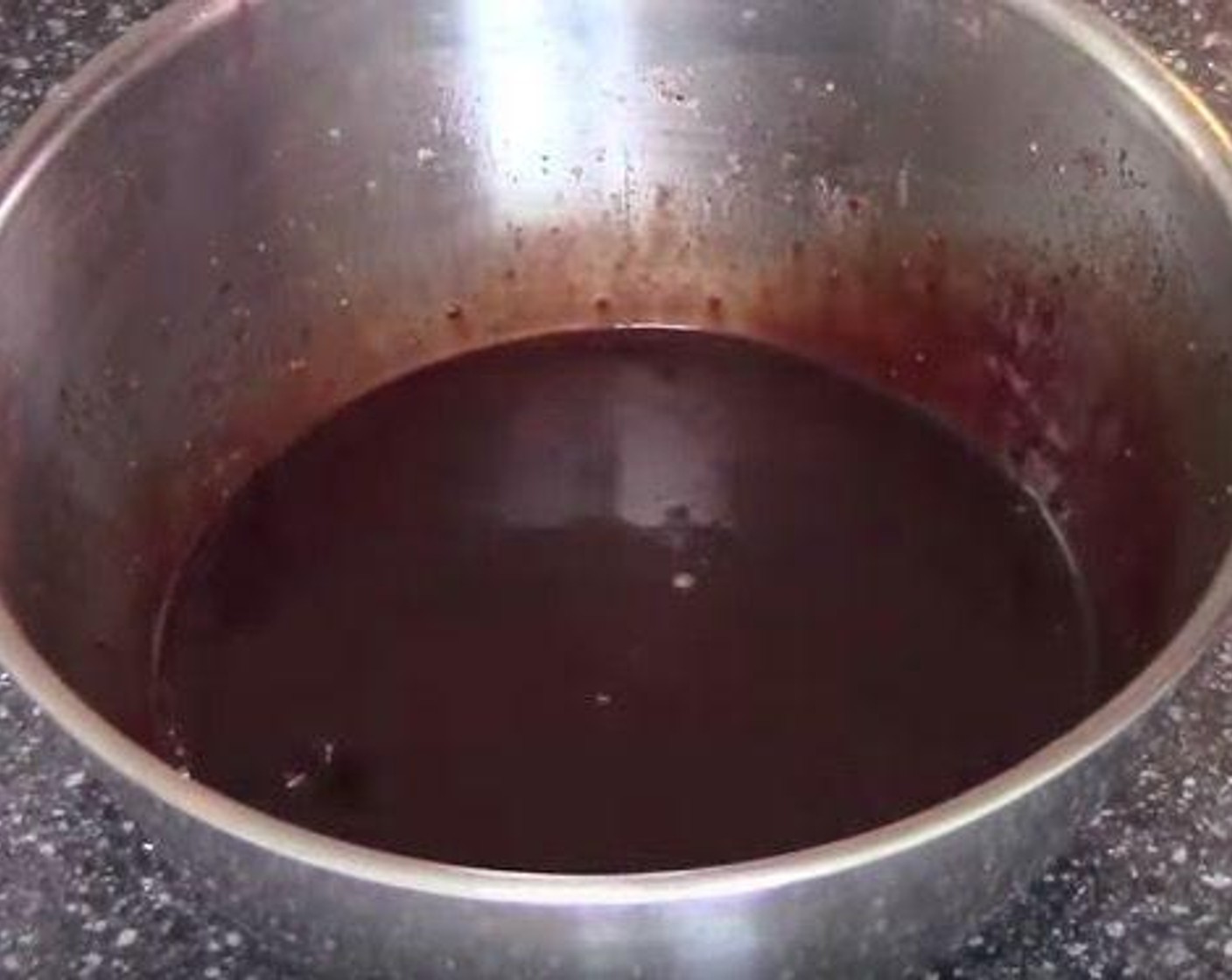 step 2 Make the chocolate icing: Sift Powdered Confectioners Sugar (3 cups) and Unsweetened Cocoa Powder (2 Tbsp) into a large mixing bowl. Add Vanilla Extract (1 tsp) and Water (as needed) and mix everything together.