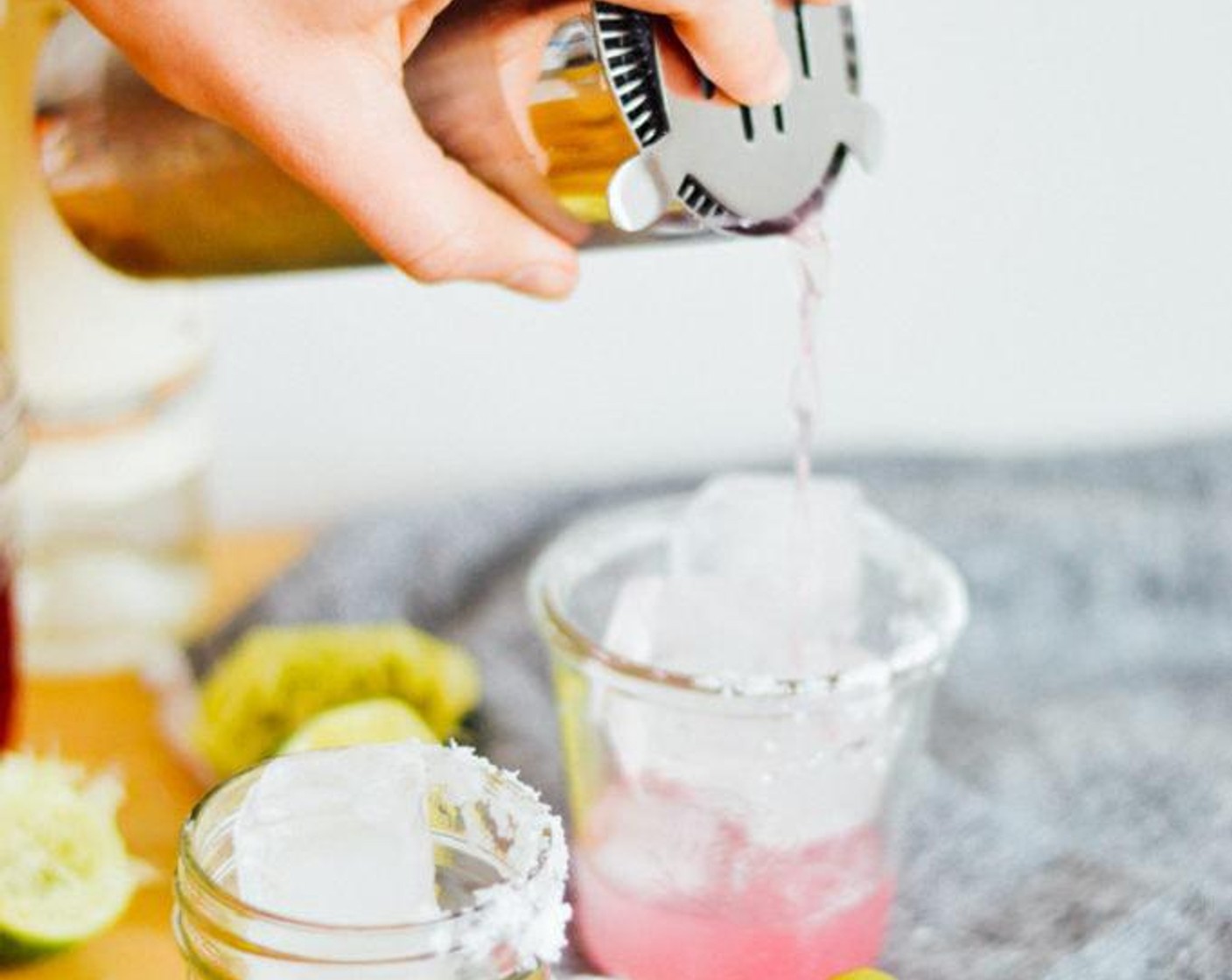 step 4 Pour margarita over ice and garnish with lime slices.