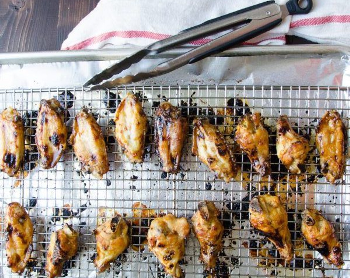 step 8 Remove them from the oven and flip them over. Brush again with the marinade and cook for an additional 8 to 10 minutes until crisp and brown.