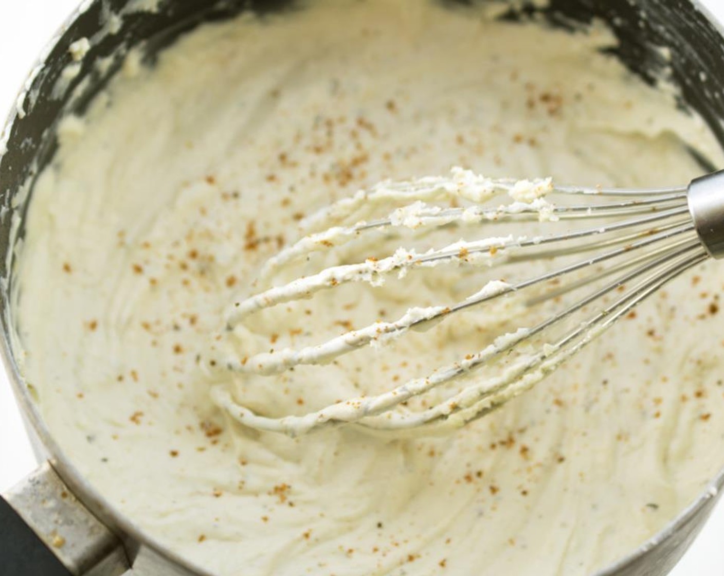 step 2 Heat a medium saucepan and add the Garlic and Herb Gourney Cheese (1 pckg), Philadelphia Original Soft Cheese (1 cup), Tabasco® Original Red Pepper Sauce (1/4 tsp), Worcestershire Sauce (1/4 tsp), and Old Bay® Seasoning (1 dash).