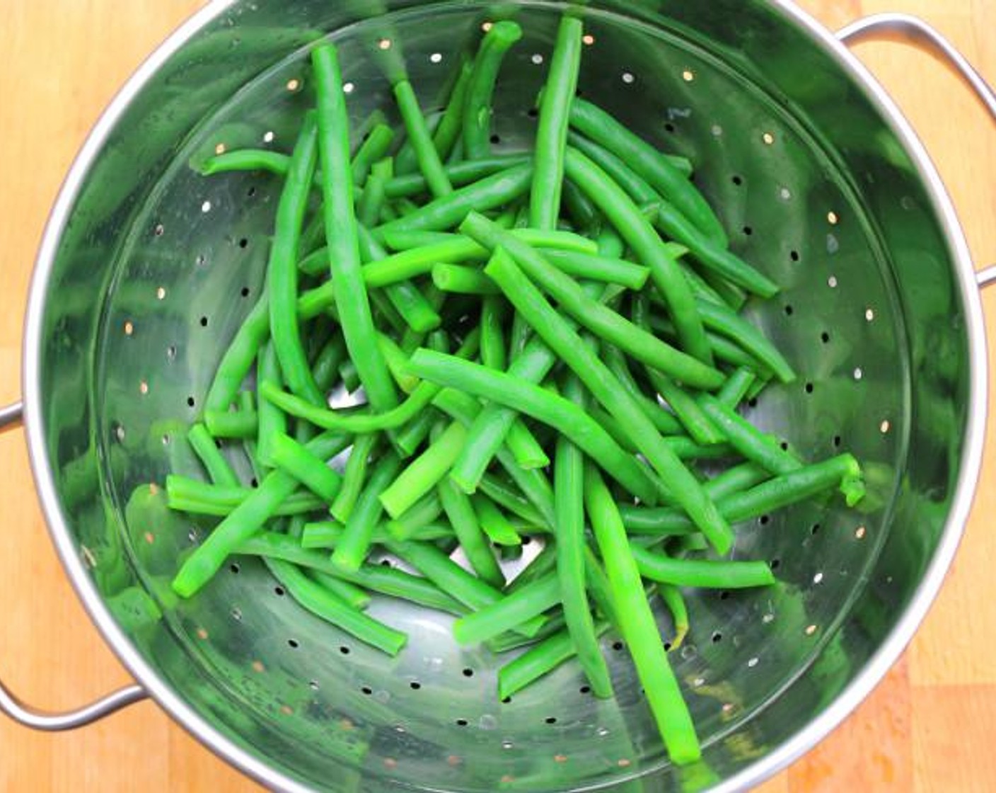 step 3 Blanche, shock, and drain the Green Beans (2 cups). "Blanching" means dropping them in boiling water for 60 seconds, then transferring them to a bowl of ice water to stop the cooking.