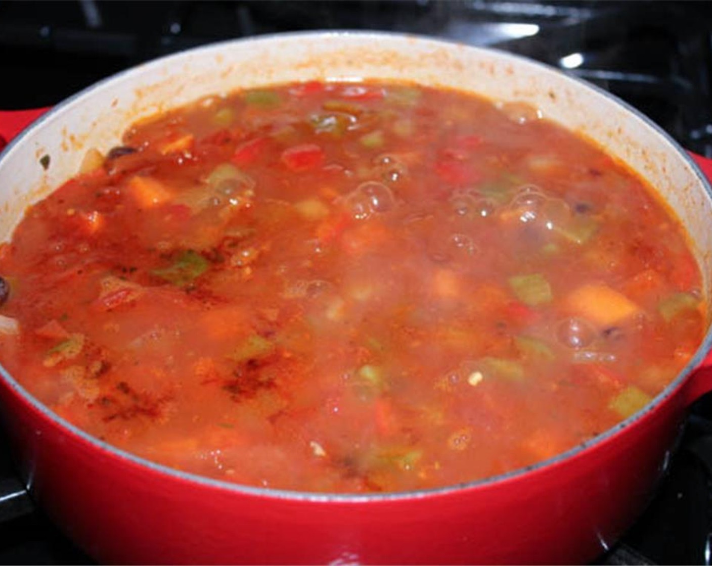 step 4 Bring your chili to a boil over high heat. Lower to a simmer and cook, covered, for about 30 minutes until the sweet potatoes are very tender. Remove the lid and simmer for 10 more minutes or until the chili has thickened slightly.