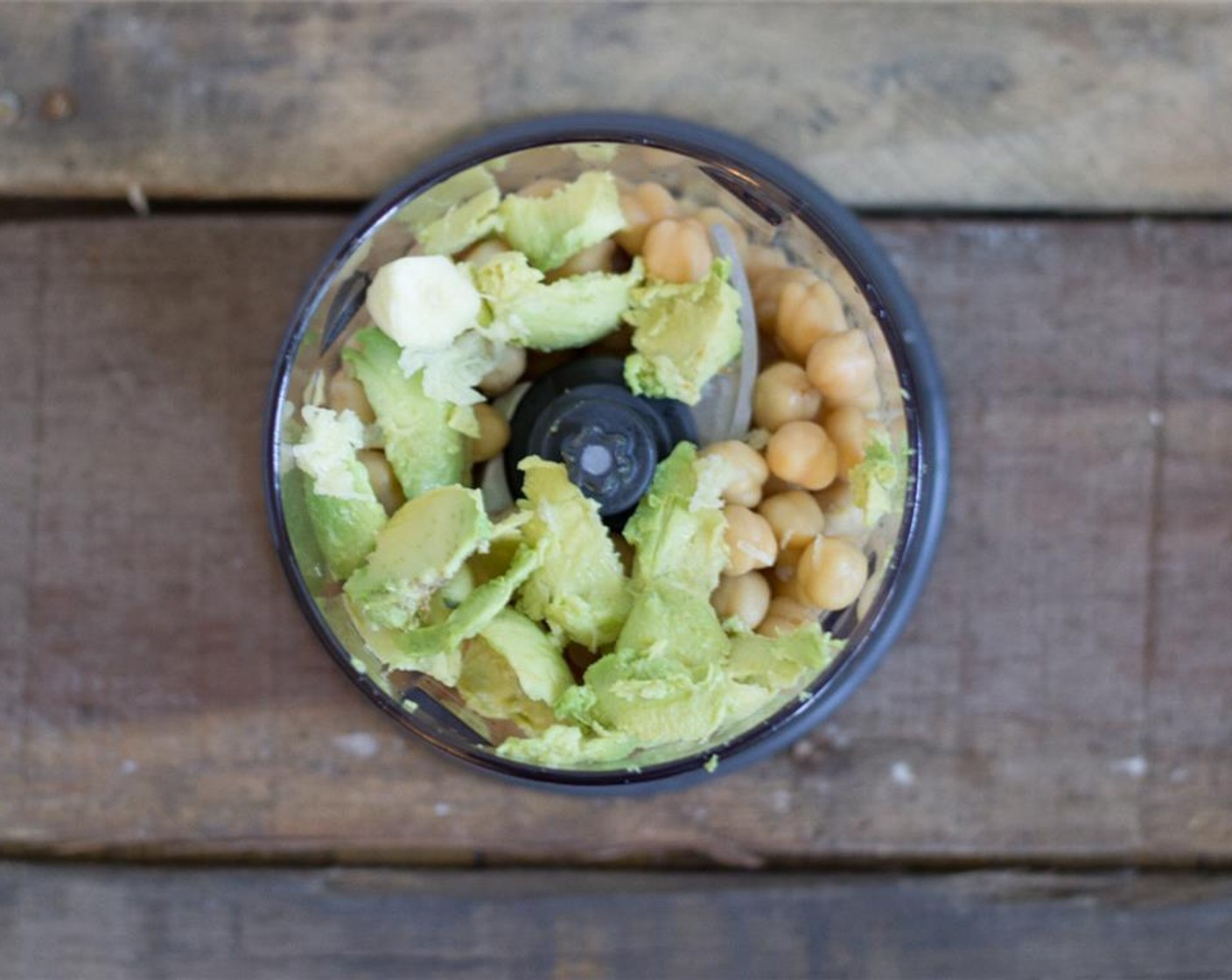 step 2 Place chickpeas, Avocado (1), grated garlic, lemon juice, Salt (to taste), Ground Black Pepper (to taste) and Feta Cheese (to taste) in your food processor and blend until spreadable.