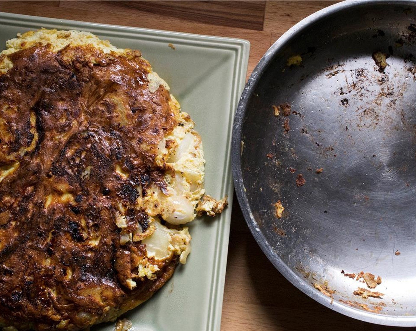 step 12 Place a plate (slightly larger than the pan) on top of the skillet.  Using oven mitts, quickly turn the tortilla upside down on to the plate.