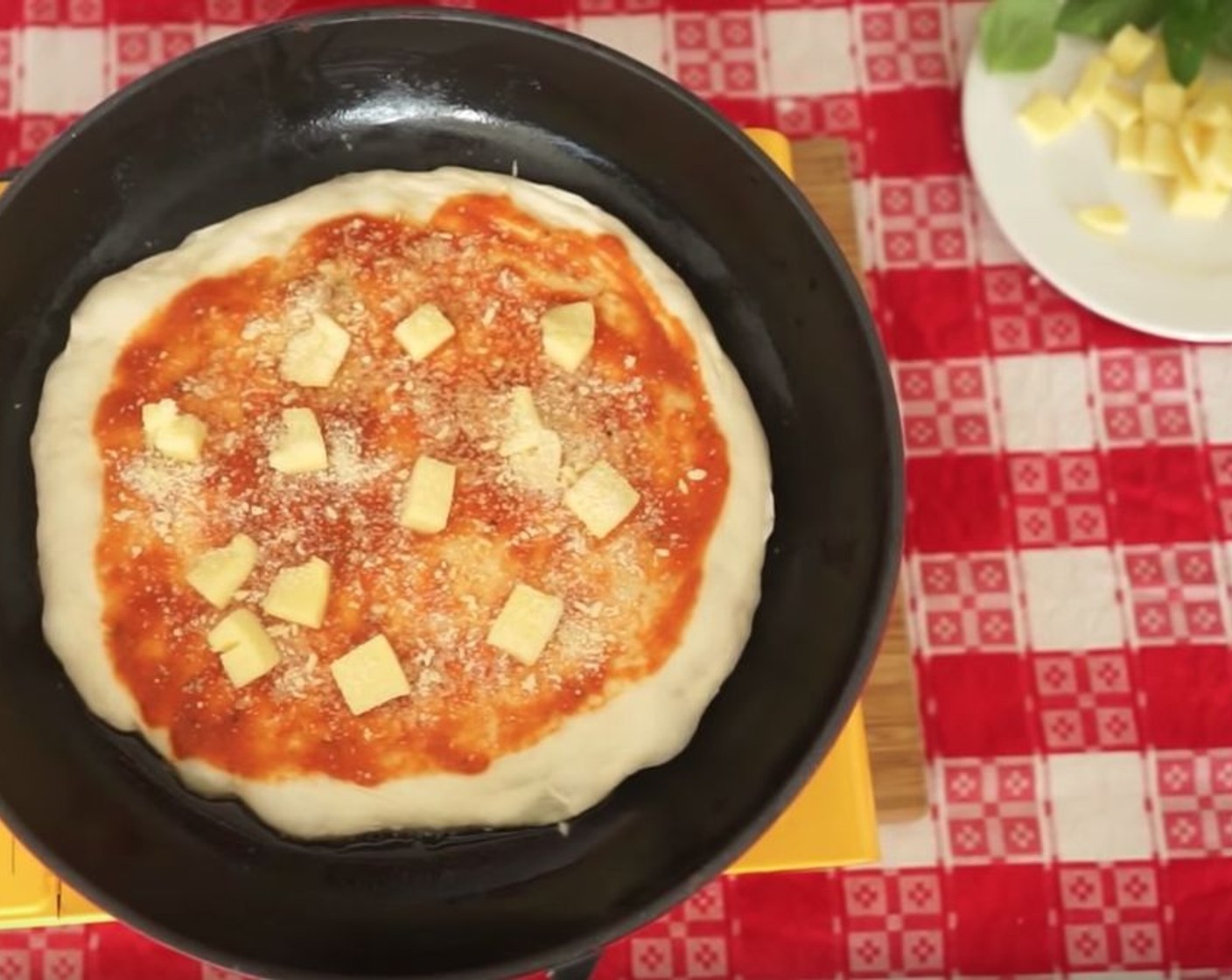 step 13 Spread some Tomato Sauce (to taste) on top, leaving space for the crust around the edges. Place Mozzarella Cheese (to taste) over the pizza, along with a generous sprinkle of Grated Parmesan Cheese (to taste) and a drizzle of Extra-Virgin Olive Oil (as needed).