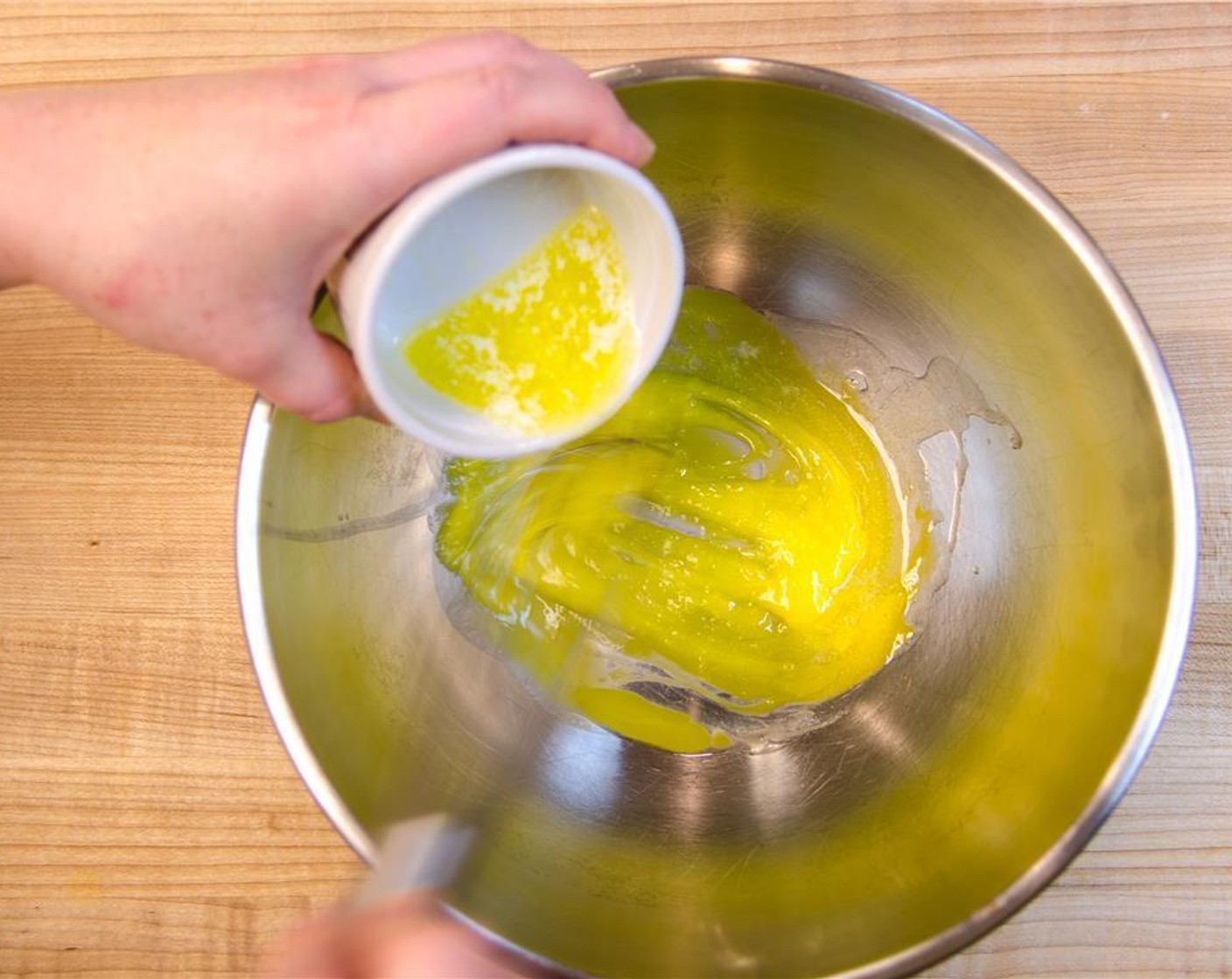 step 3 Whisk the melted butter into the yolks.
