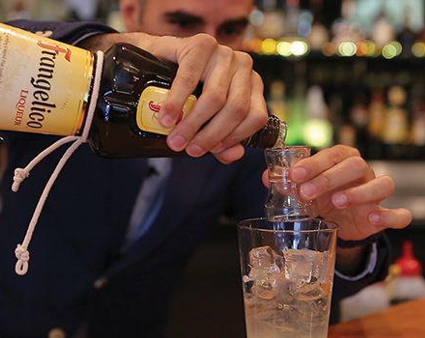 step 2 Fill a mixing glass with Ice (to taste) and add Limoncello (2 Tbsp), Pinot Grigio (2 Tbsp), Frangelico (1 Tbsp), juice from Lemon (1) and Simple Syrup (1 dash).