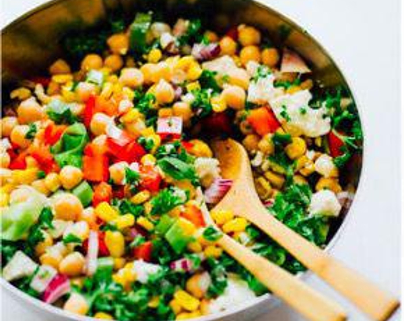 step 2 In a large bowl, toss together cooked corn, Canned Chickpeas (2 cups), Red Bell Pepper (1), Red Onion (1/4 cup), Scallion (1/2 cup), Fresh Parsley (1/2 cup), and Crumbled Feta Cheese (1/2 cup).