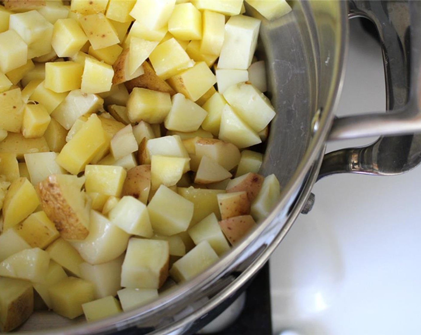 step 2 Add Potatoes (2.3 lb) and Parsnips (1 2/3 cups) to a steamer basket and add to the pot. Cook for about 10 to 12 minutes. Cool completely.