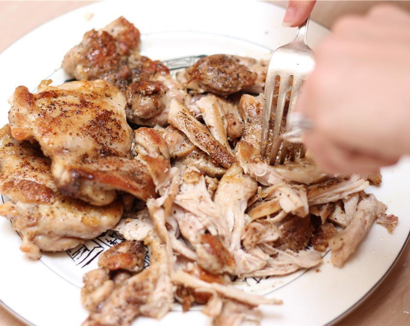 step 14 When the chicken is cool enough to handle, use two forks to shred into bite-sized pieces.