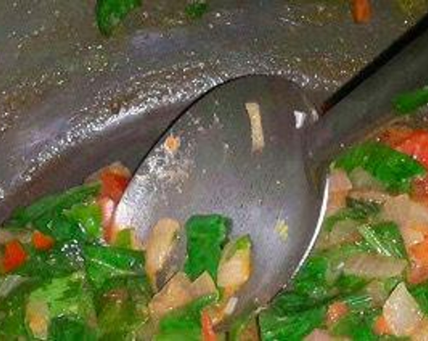 step 3 In the pressure cooker, add Oil (3 Tbsp), Cumin Seeds (1 tsp), Onion (1), Green Chili Pepper (1), Fresh Ginger (1 in), and Garlic (3 cloves). Cook for about 2 minutes, until onion becomes transparent and soft.