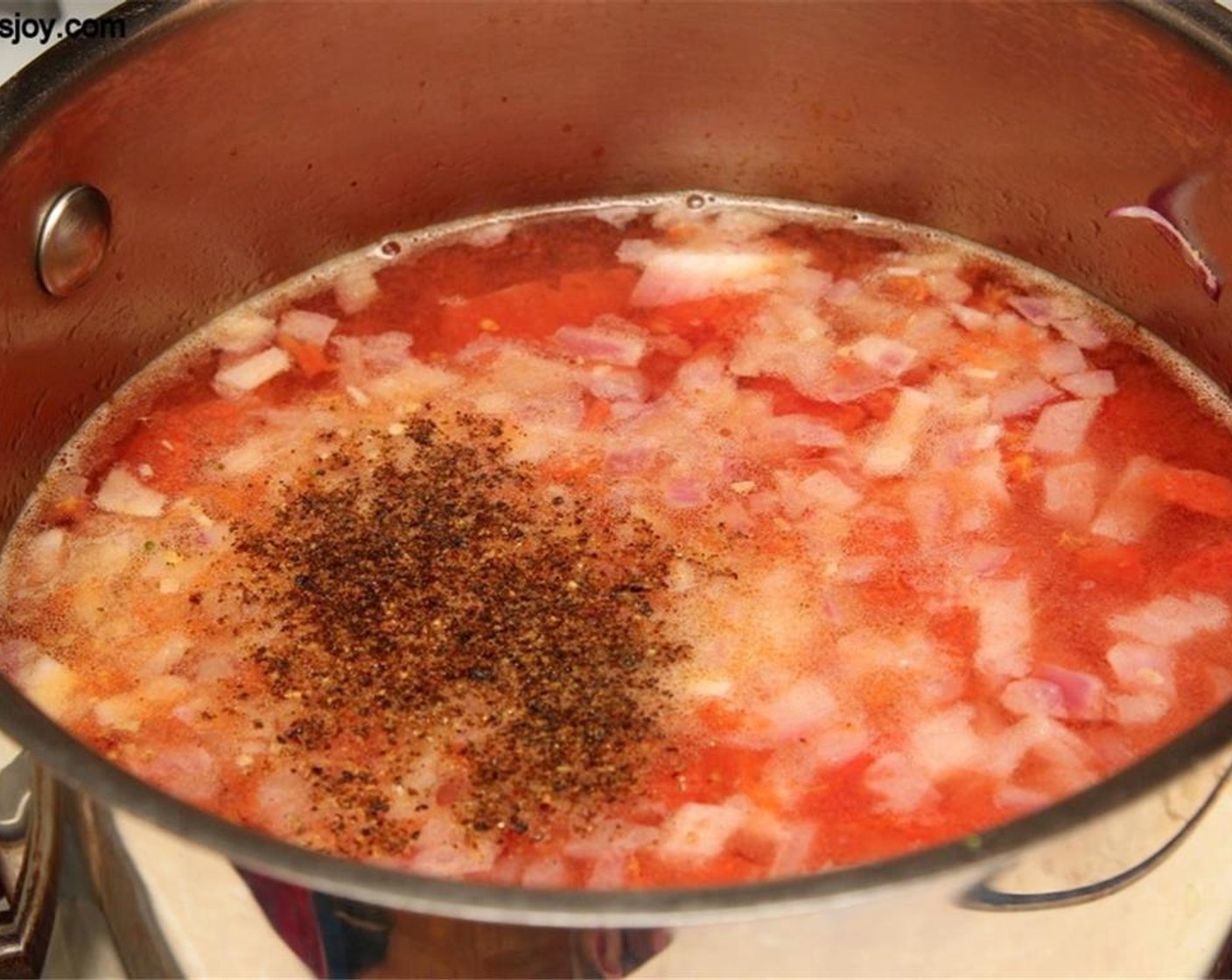 step 2 Add the Tomato (3/4 cup), Water (3 cups), Salt (to taste) and Ground Black Pepper (to taste). Bring to a boil.