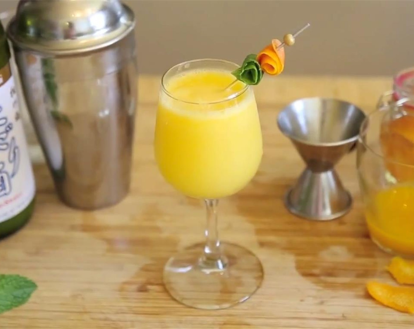 step 3 Strain into a glass, garnish with an orange peel and Fresh Mint (1 sprig), serve, and enjoy!
