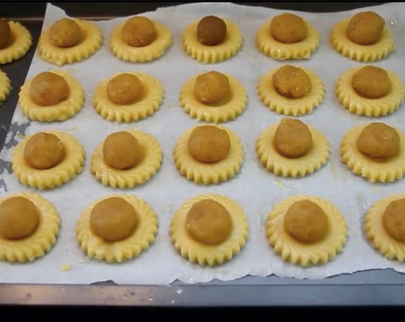 step 11 Combine Eggland's Best Classic Egg (1) and Water (1 Tbsp) to make egg wash. Brush the mixture onto each cookie. Top each cookie with a ball of pineapple filling. Let sit in the fridge while you preheat the oven to 170 degrees C (340 degrees F).