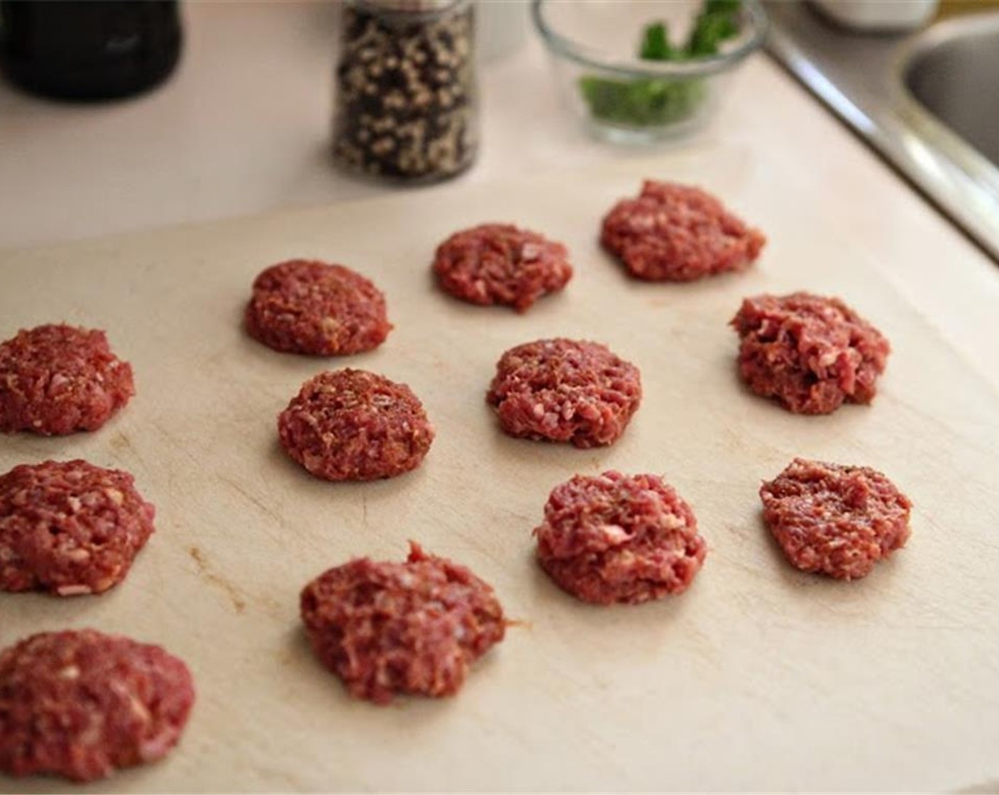 step 2 Add Curry Salt (1/2 Tbsp) to the Ground Guinea Hen (12 oz) meat, and mix thoroughly. Divide into 12 equal portions, and press each portion into a flattened meatball.