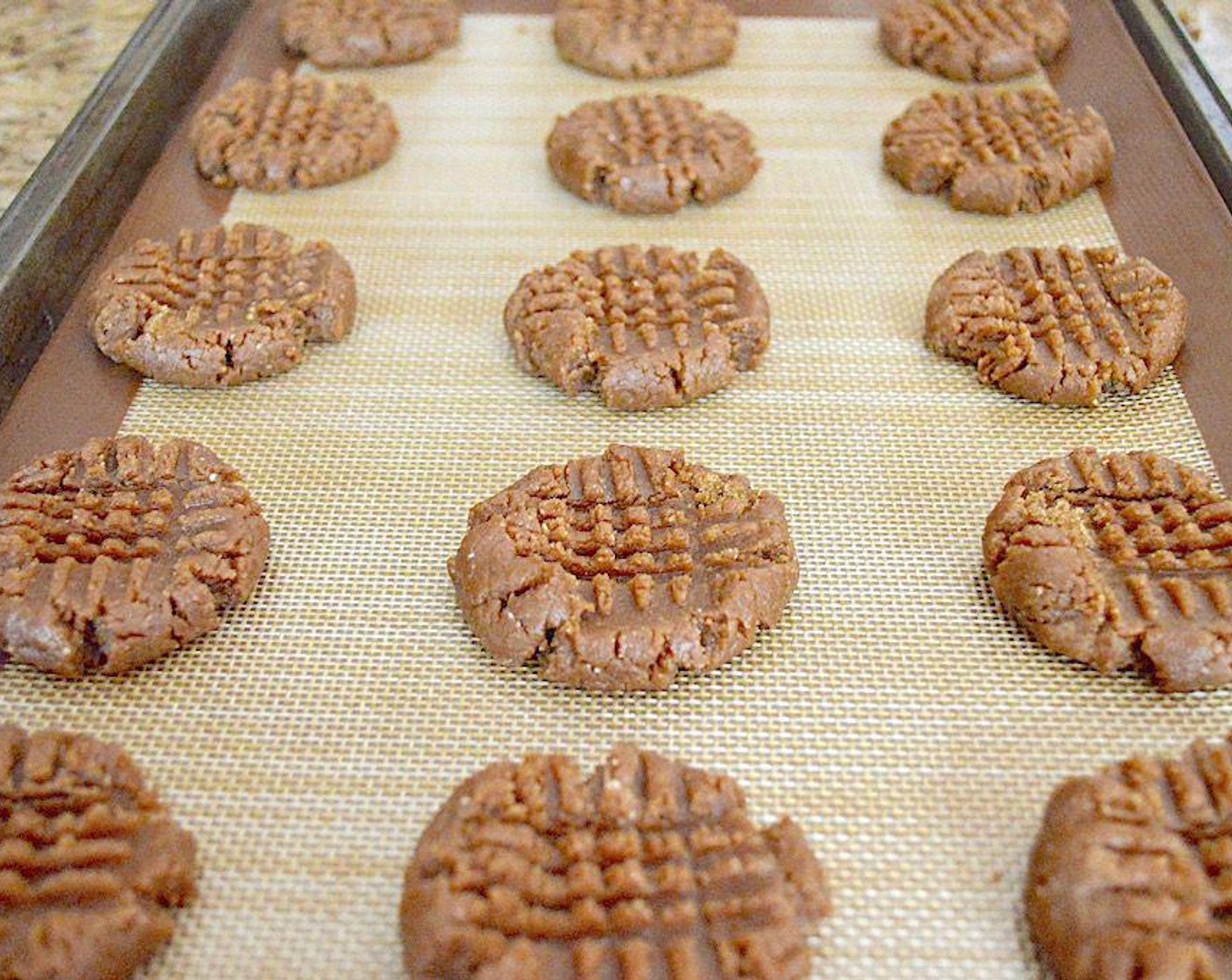 step 3 Use a 1.5-inch cookie scoop to scoop perfect little mounds of the dough onto the cookie sheet. You should get about 15. Use a fork to flatten the mounds vertically and horizontally to make the cross marks.