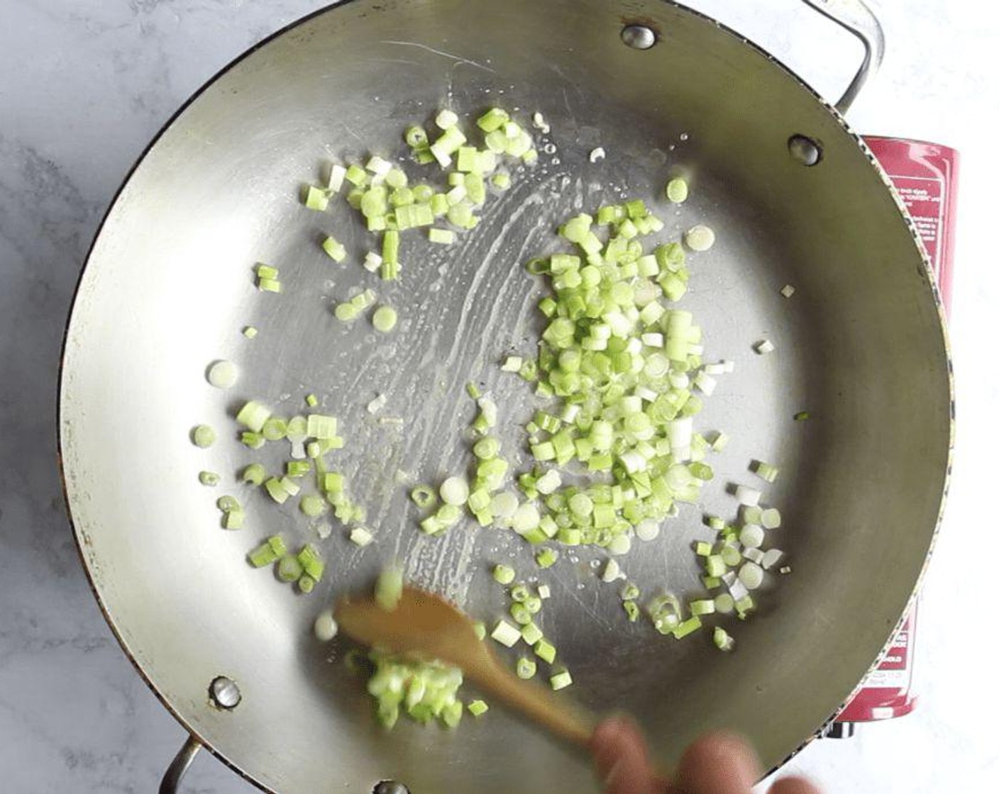 step 2 Meanwhile, heat Unsalted Butter (1 Tbsp) in large sauté pan over medium heat; add Scallion (1 bunch) and a pinch of Kosher Salt (to taste) and cook until soft, for 3 minutes.