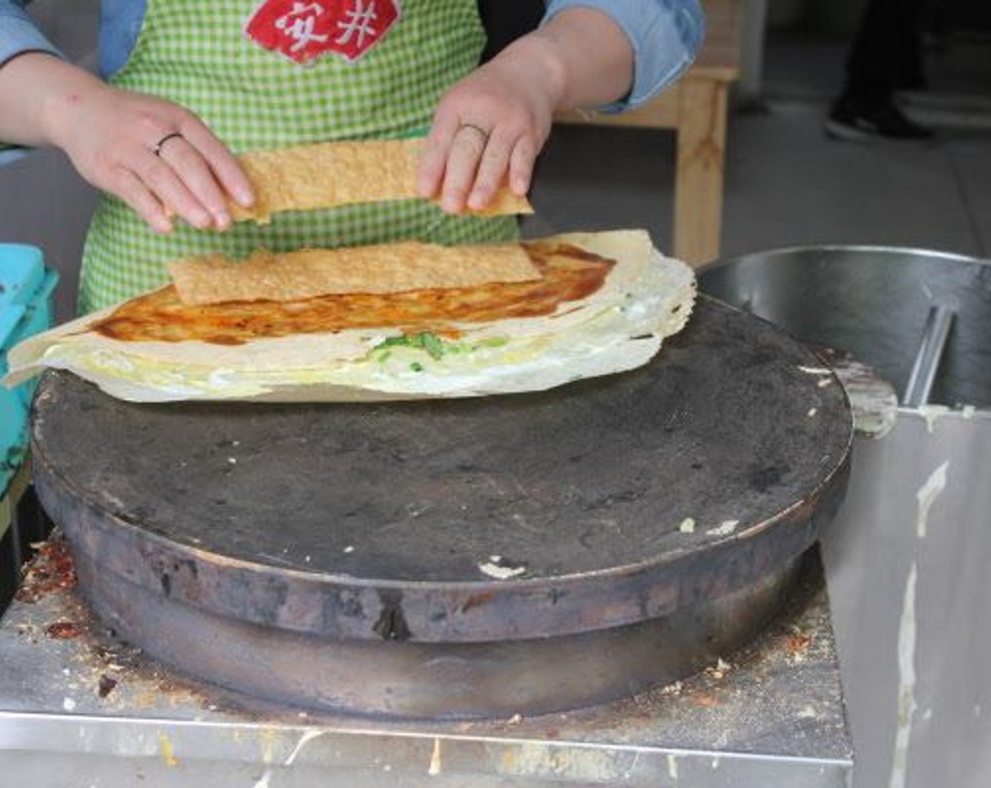 step 9 Place the Wonton Wrappers (2) in the middle of the pancake.