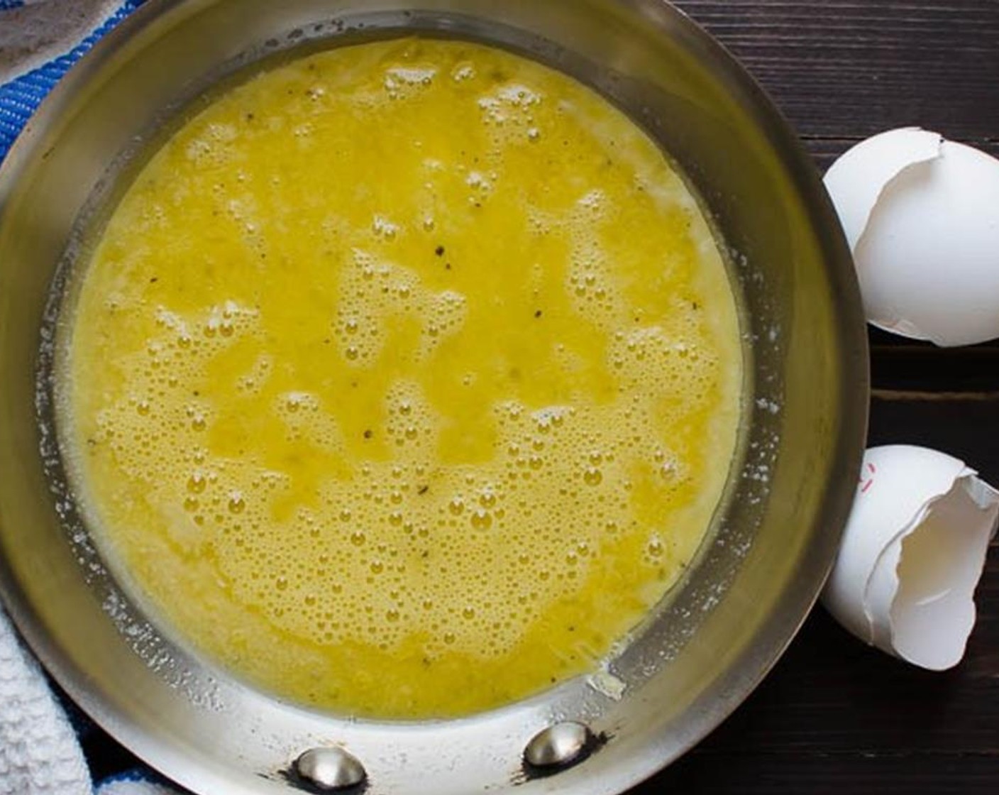 step 1 Whisk Eggs (4), Salt (to taste), and Ground Black Pepper (to taste) in a small bowl until frothy. In a medium skillet, melt the Butter (1 1/2 Tbsp) in a pan, and add the eggs.