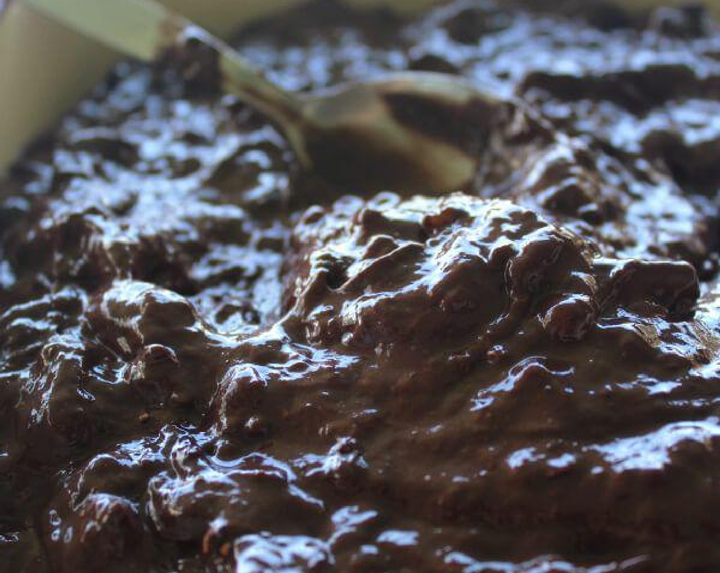 step 3 Add the Dark Chocolate Chips (1/3 cup), Unsweetened Cocoa Powder (1 cup), Dates (3/4 cup), and Baking Soda (1/2 tsp) and fold until just combined. Pour the mixture into the baking tin and level it out with a metal spoon.
