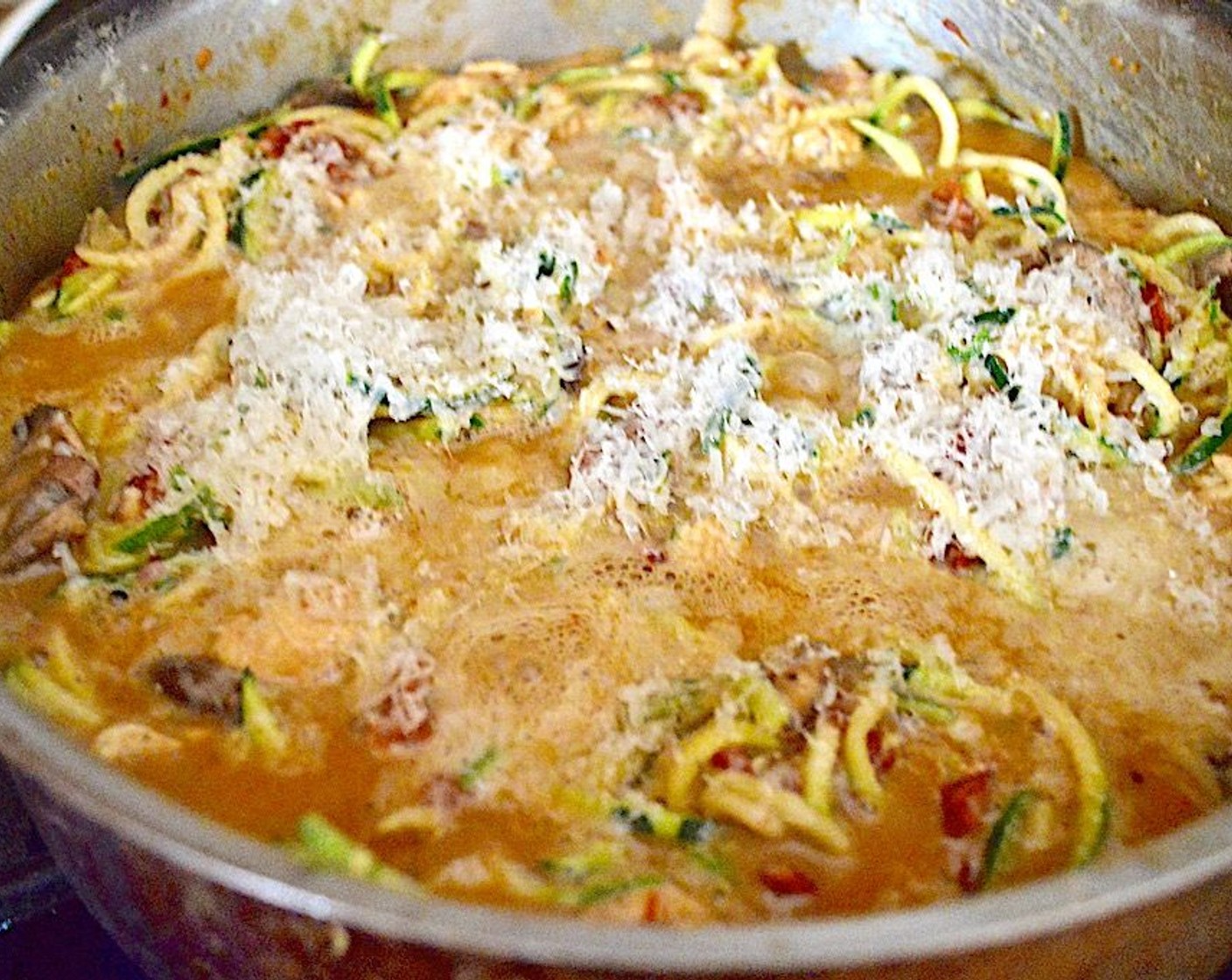 step 6 Return the chicken and veggies to the pan and also add in Zucchini (4). Stir everything well, then sprinkle the Parmesan Cheese (1/4 cup) on top. Let it bubble for a minute on the stove, then transfer it to the oven to bake for 15 minutes.