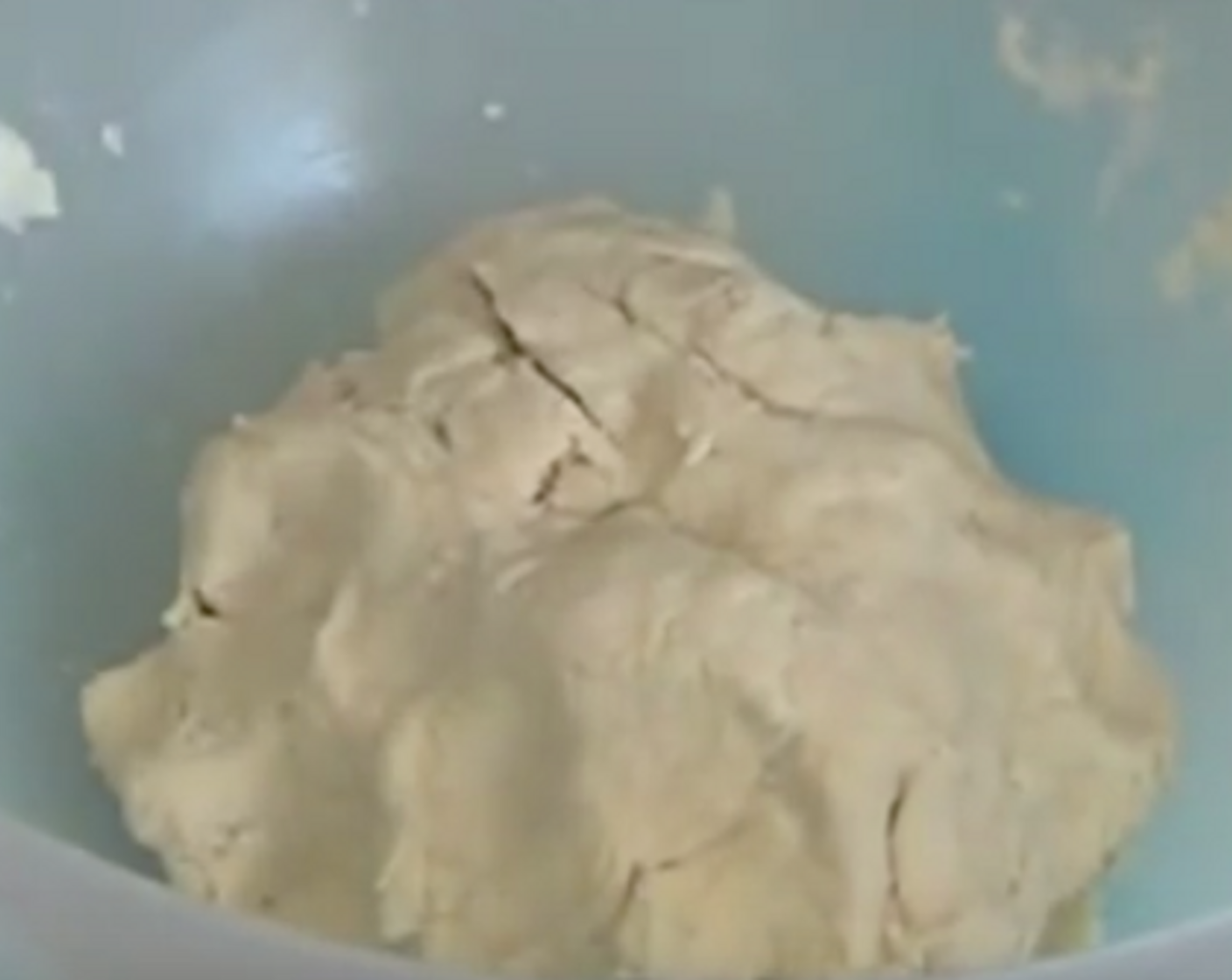 step 4 Add in the Milk (2/3 cup) and use a spoon to whisk. Shape the dough roughly into a ball.