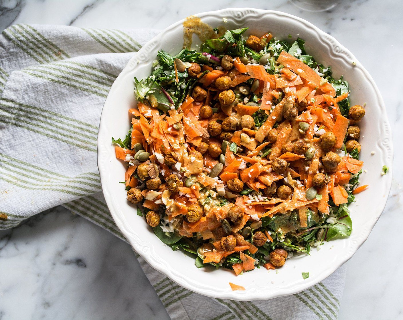 step 10 Top with Sliced Almonds (1/2 cup), Pepitas (1/4 cup), and roasted chickpeas, then drizzle with your favorite salad dressing.