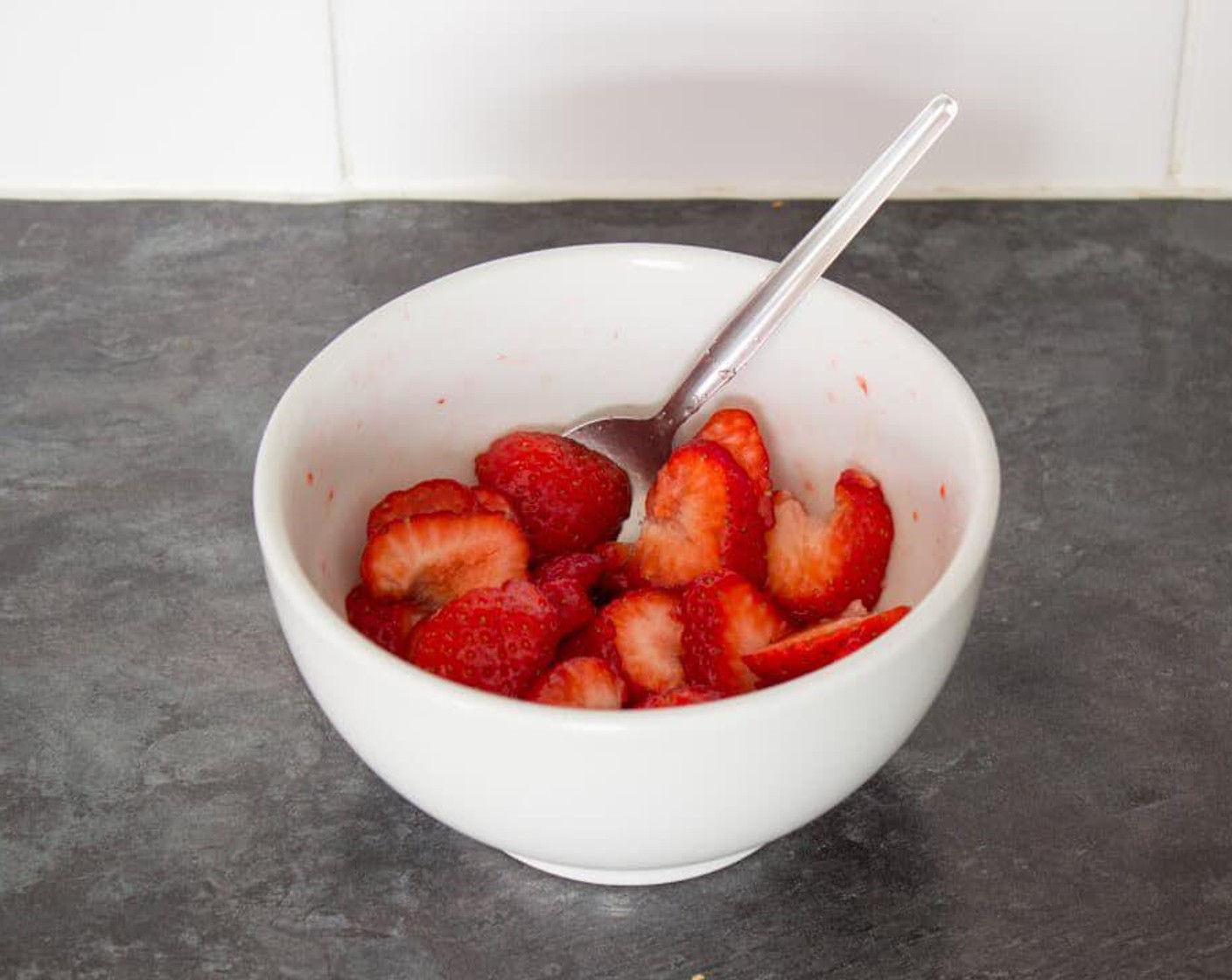 step 1 First thing’s first. Hull and slice your Fresh Strawberry (3/4 cup) then pop them into a bowl. Sprinkle over Caster Sugar (1 tsp), gently mix and leave to one side.