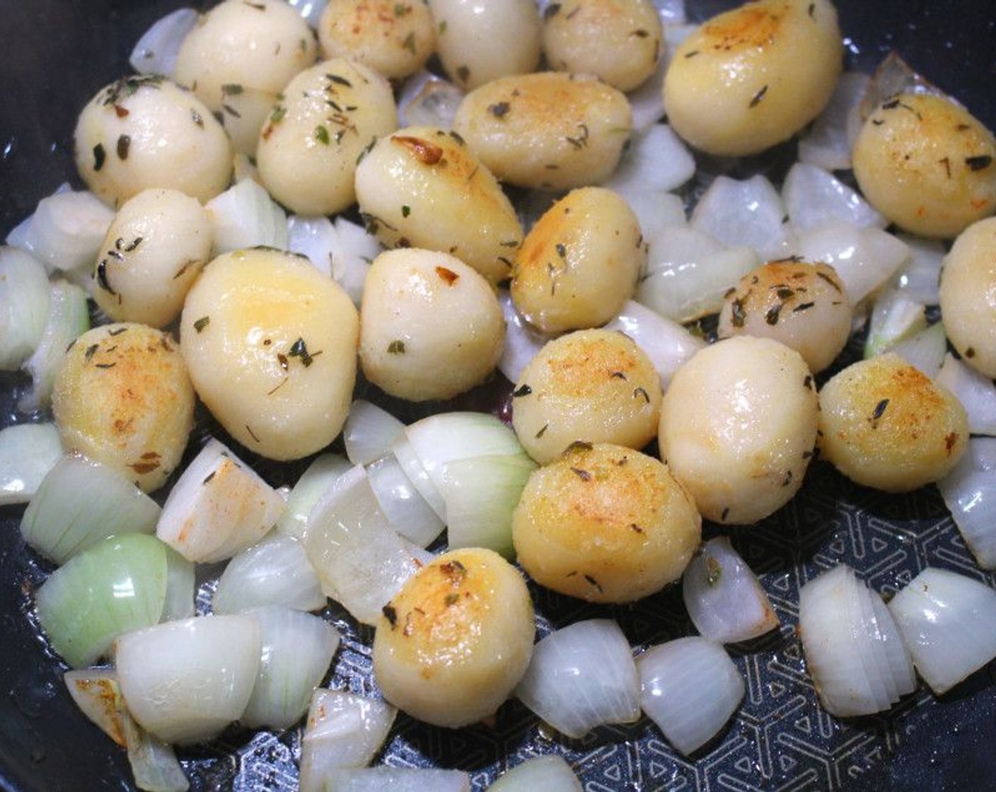 step 4 In the same pan, sauté Potatoes (2 cups) and Onion (1/2 cup) in Butter (1/2 cup). Season with Fresh Thyme (to taste), Fresh Oregano (to taste), Cayenne Pepper (to taste), and Kosher Salt (to taste).