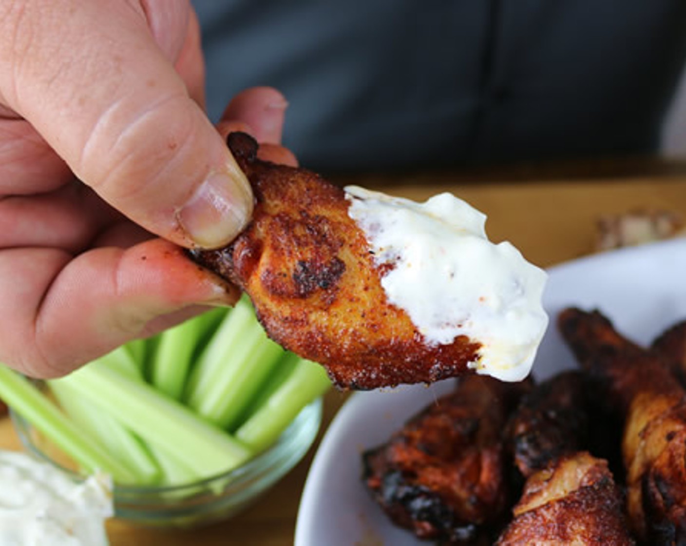 step 8 Arrange the wings on a platter with a light dusting of Killer Hogs Hot Rub, Creamy Blue Cheese Dressing and Celery Sticks.