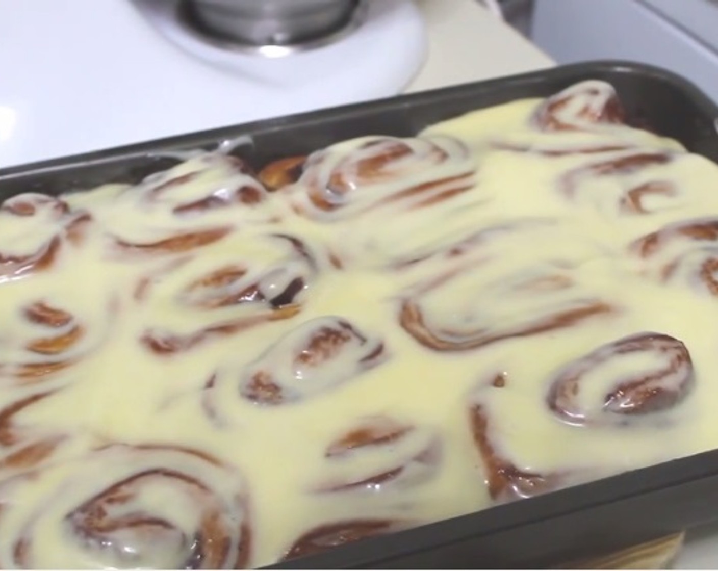 step 12 Pour the glaze over the baked rolls and serve!